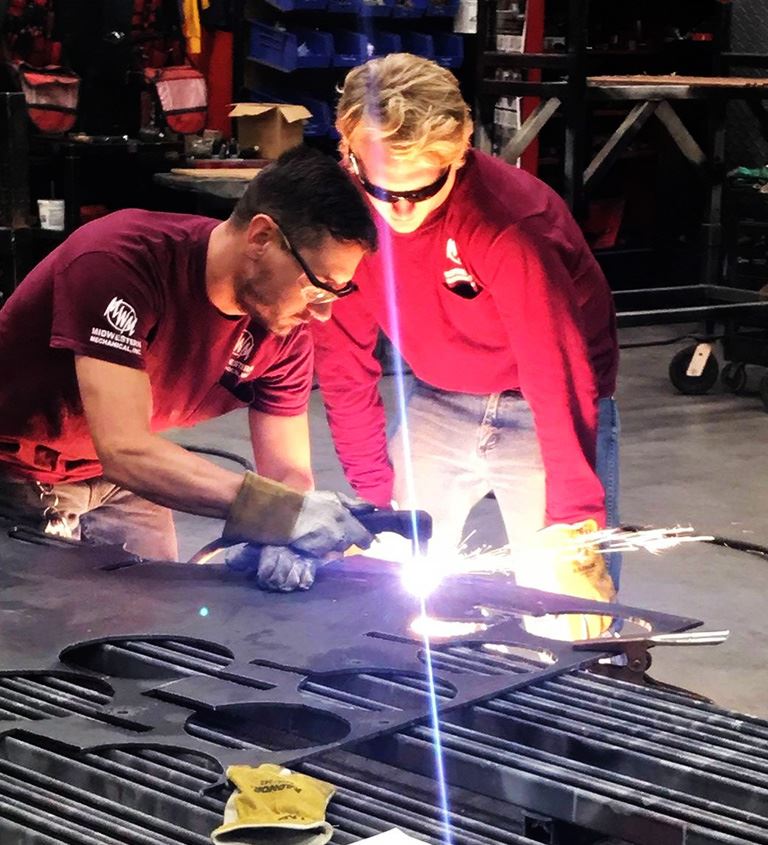 Two Men Welding